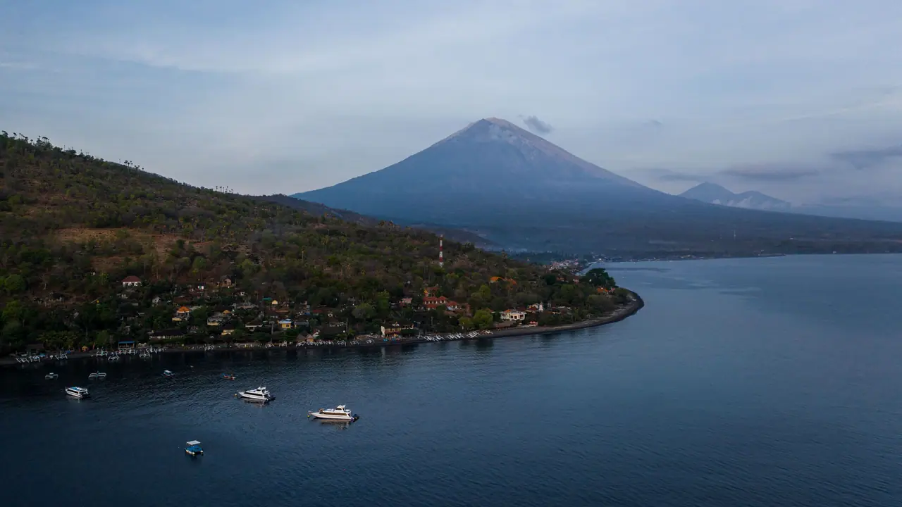 Morning light over Amuk Bay on the east coast of Bali with Mount Agung in the distance