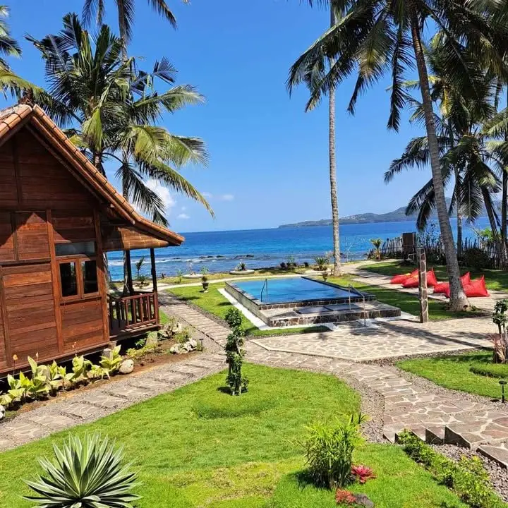Wooden house, garden path and pool facing the sea at Wooden House Candidasa